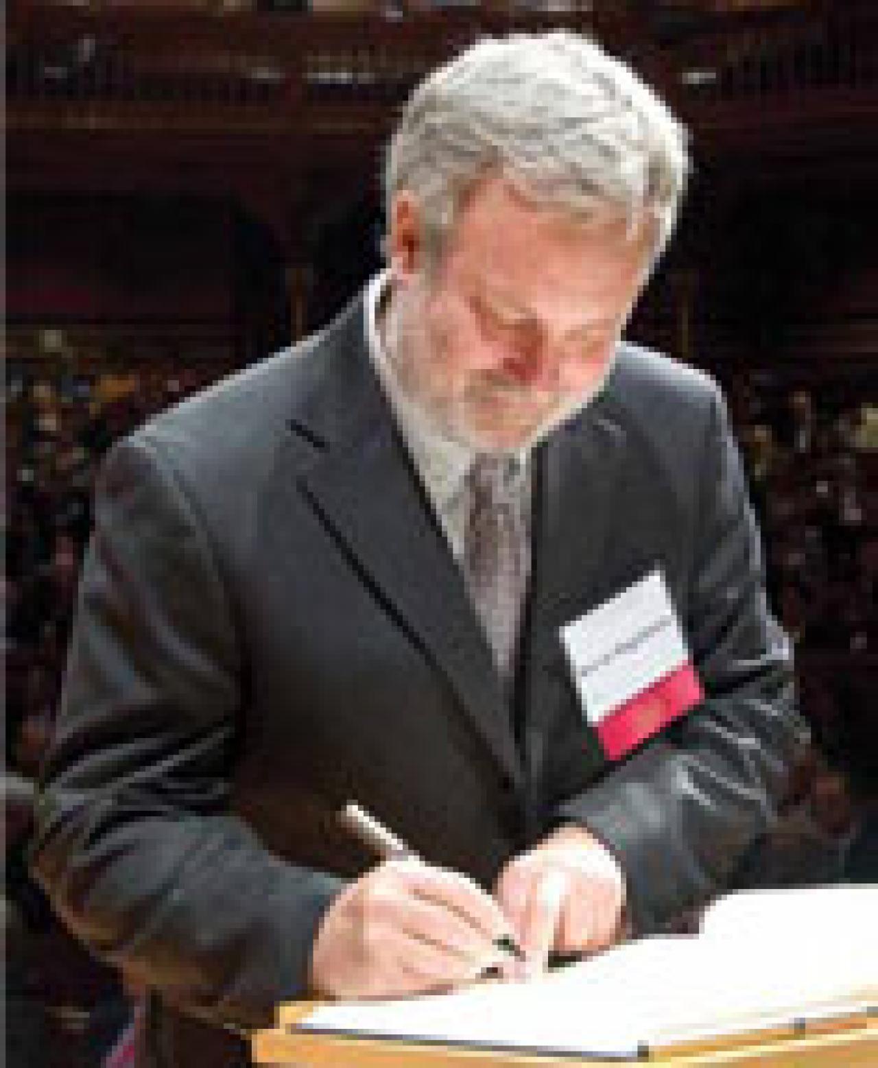 Steven Siegelbaum signing the American Academy of Arts & Sciences Book of Members, a tradition that dates back to 1780.