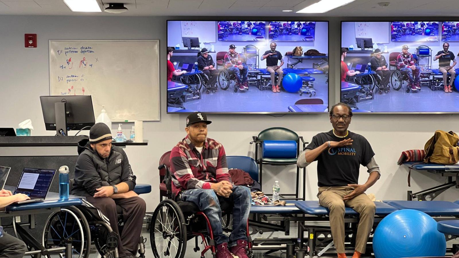 Lawrence answering a question asked in class.