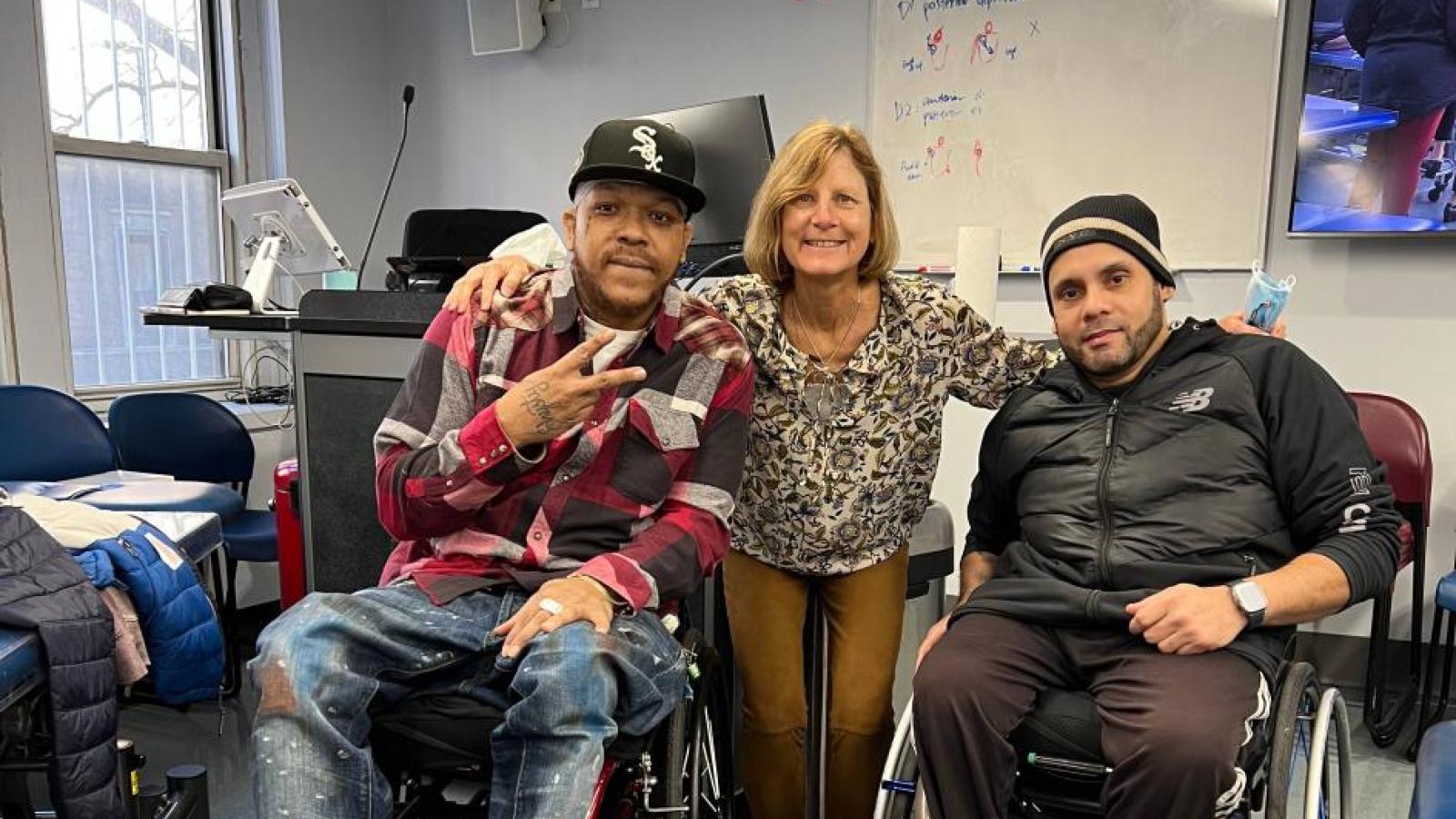 Dr. Sliwinski with two patients in class.