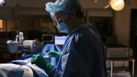 surgeon performing tavr procedure