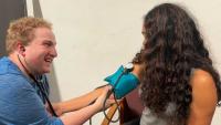 Medical student checking a patient’s blood pressure.