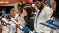 Medical students in the Class of 2020 read the Hippocratic oath at Columbia's transition ceremony.