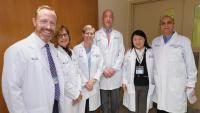 PT faculty in white coats