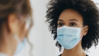 Woman with mask in doctor's office