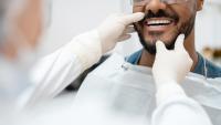 Dentist examining teeth of a patient