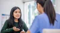 Female patient talking to her doctor