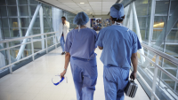 Dr. Kato and colleague walk across sky bridge to deliver organ
