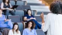 A group of students paying attention in a lecture hall