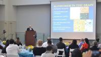 Dr. Larry Honig gives lecture on Alzheimer's Disease to a group of physicians.