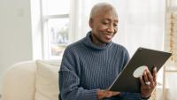 Senior women using tablet for a telehealth appointment