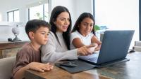 A mom and her kids using a computer