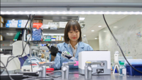 woman working in a lab with advanced equipment