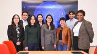 Group of people in front of a screen