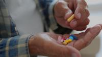 Older adult taking prescription medications
