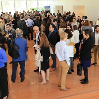 People gather to mingle in a lobby.